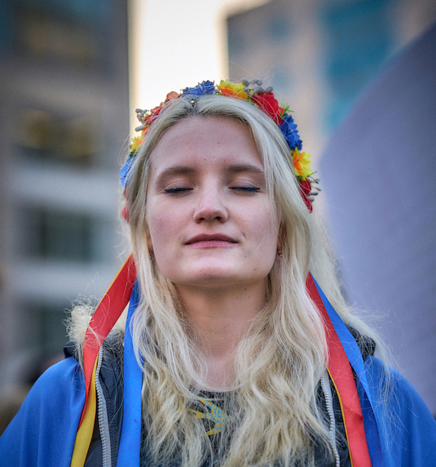 Ukrainian woman with eyes closed in Union Square, NYC, March 11, 2022